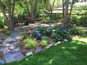 Outdoor room with flagstone path and birdbath